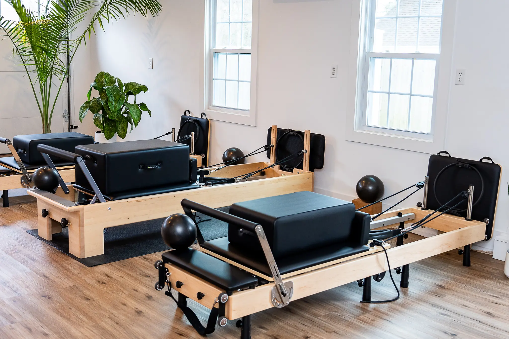 Pilates reformers in a bright studio